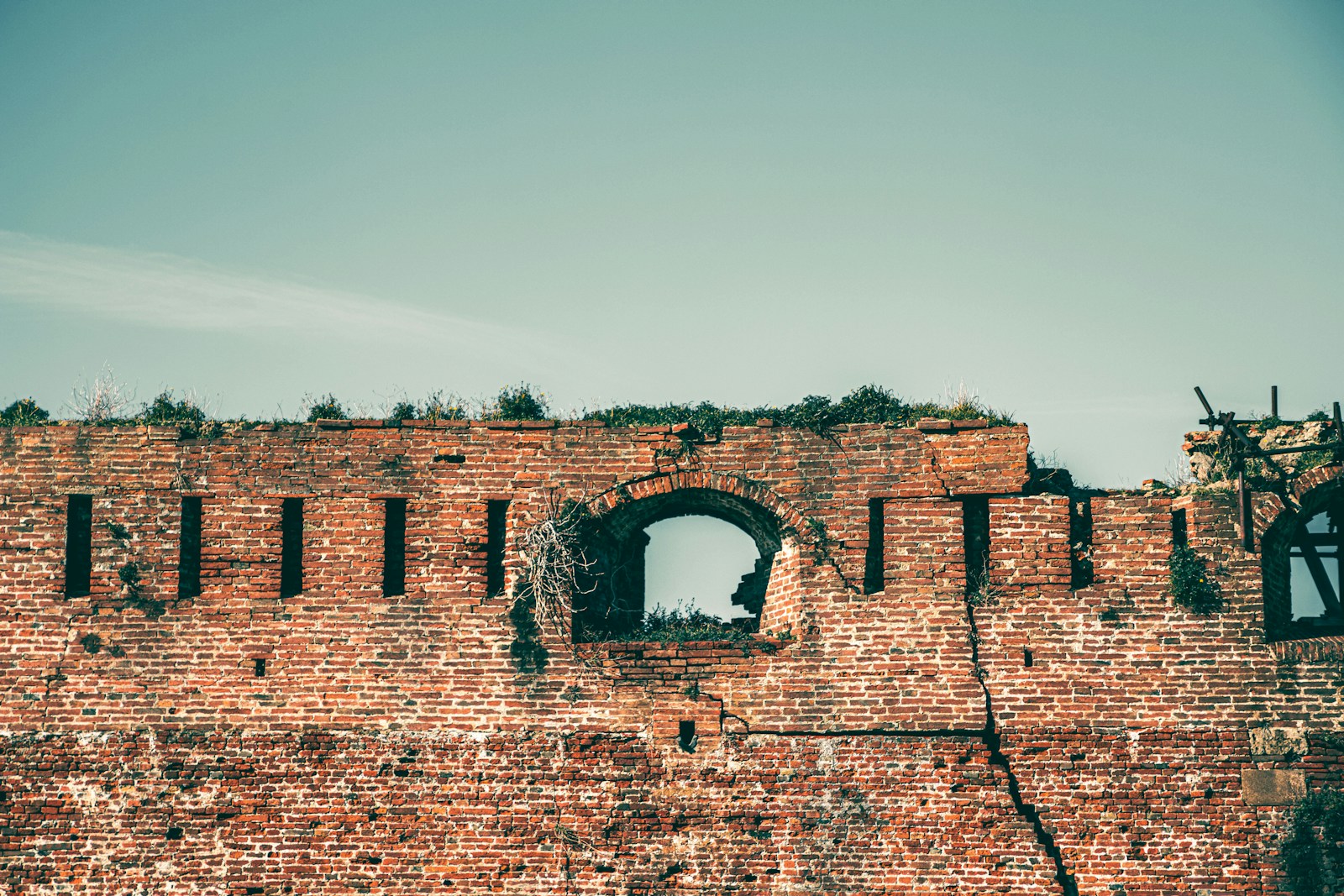 brown brick building under white sky during daytime